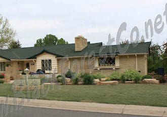 Single-story house with a well-maintained front yard and chimney.